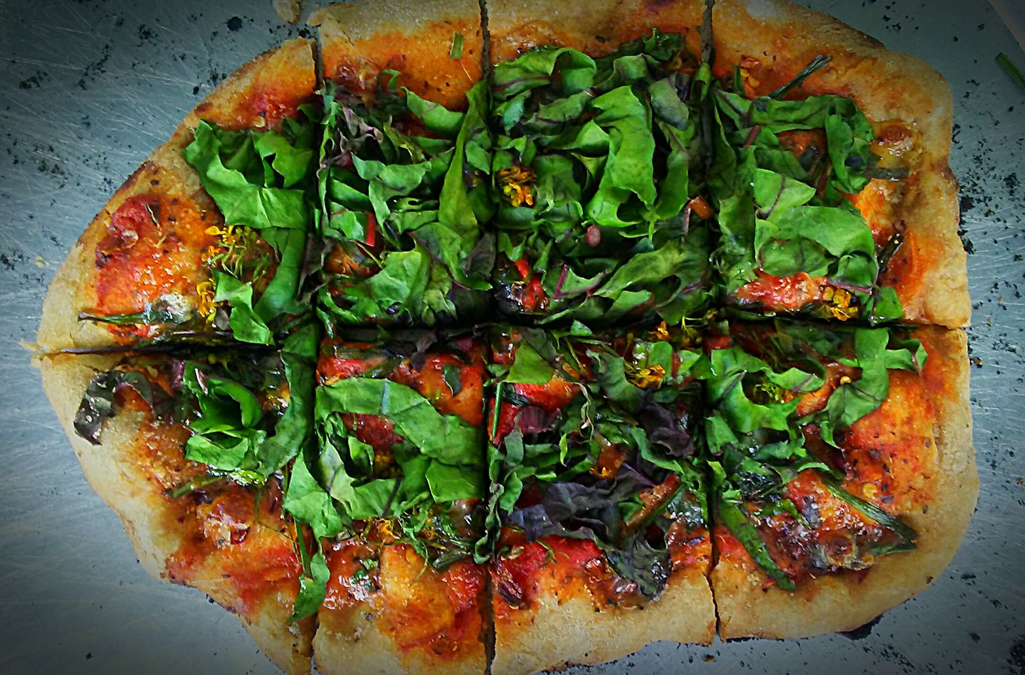 brick oven pizza with greens