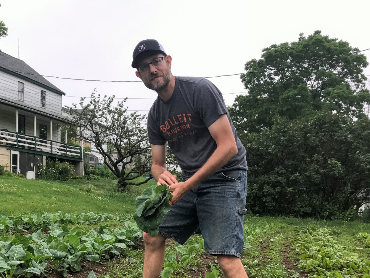 Reuben in field picking greens