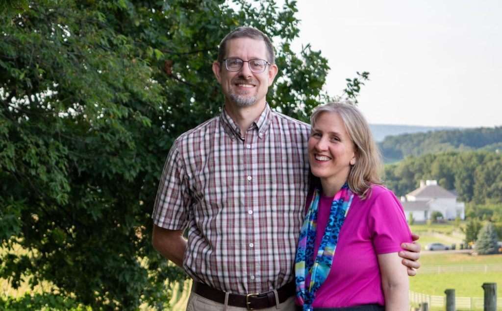 Reuben and Tessa Farmers of Willow Haven Farm in New Tripoli PA in the on the farm next to pasture