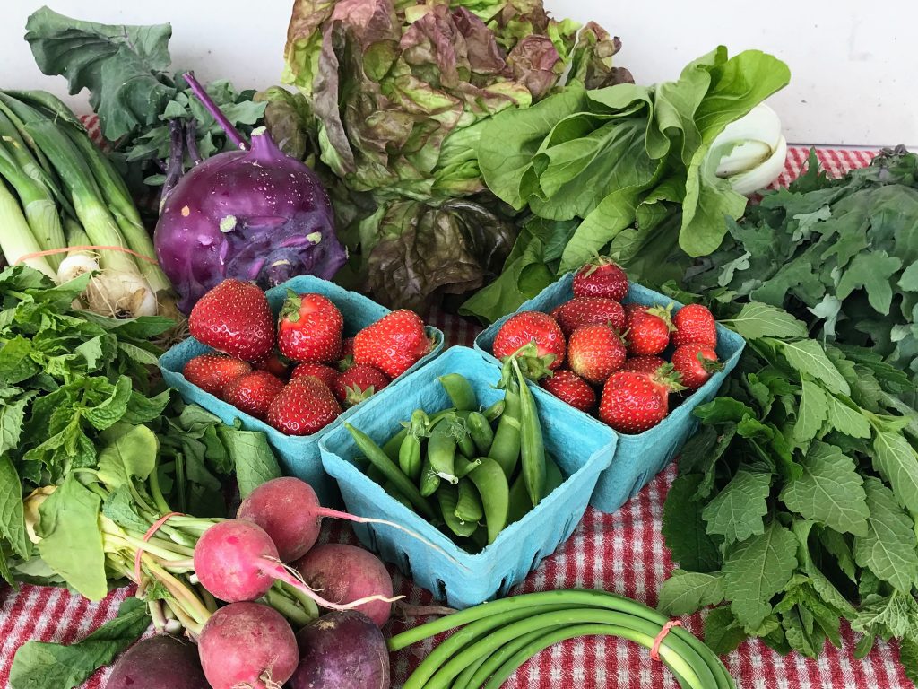 local Strawberries peas radish and greens